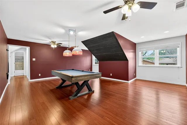 a room with furniture and wooden floor