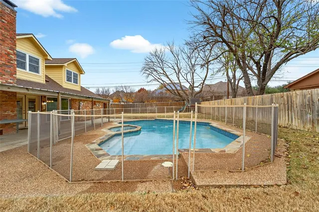 a view of a swimming pool with a patio