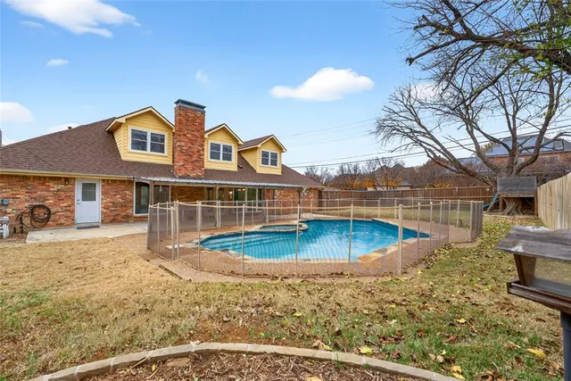 a front view of a house with swimming pool
