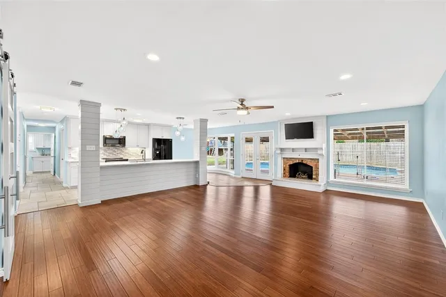 a view of living room with furniture and fireplace