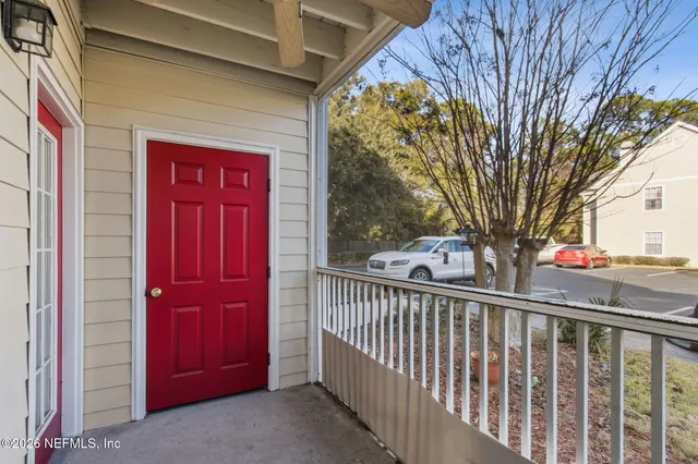 a view of a house with a red gate