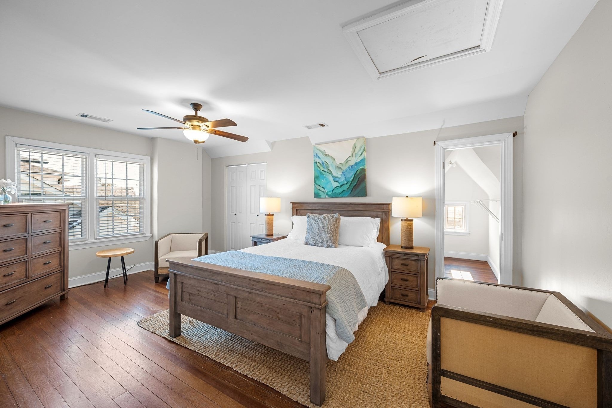 816 Inverness Avenue Nashville, TN 37204 - Photo 17 of 39 a bedroom with a bed and wooden floor