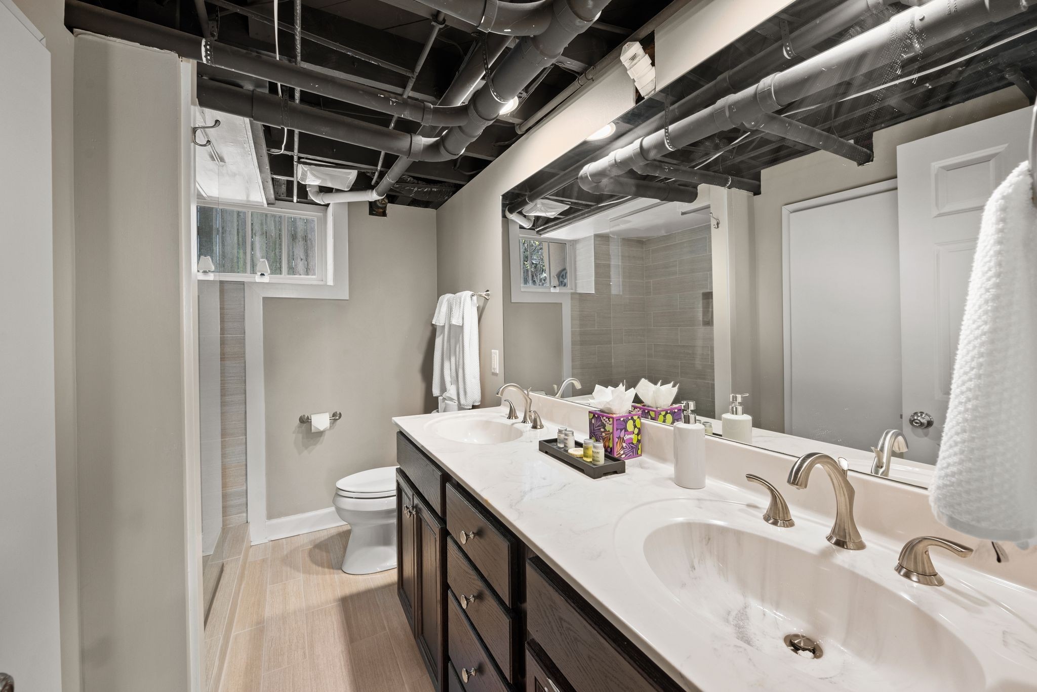 816 Inverness Avenue Nashville, TN 37204 - Photo 26 of 39 a bathroom with a double vanity sink and a mirror