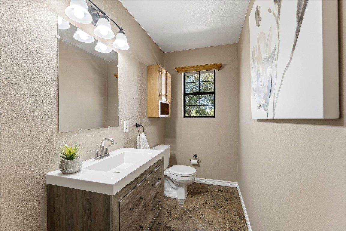 306 Starview Drive Georgetown, TX 78628 - Photo 20 of 26 Half bathroom with stone finish flooring