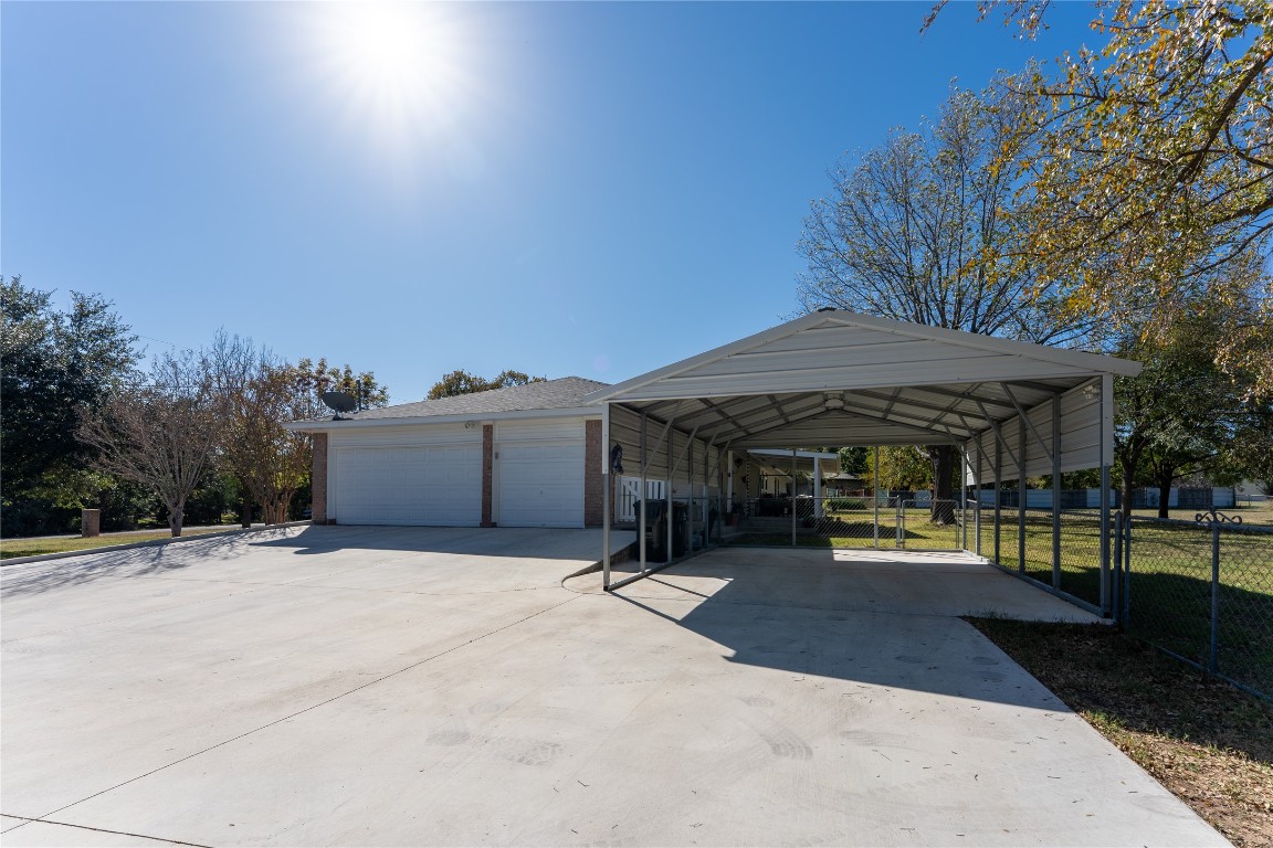 306 Starview Drive Georgetown, TX 78628 - Photo 3 of 26 Three car garage with additional carport