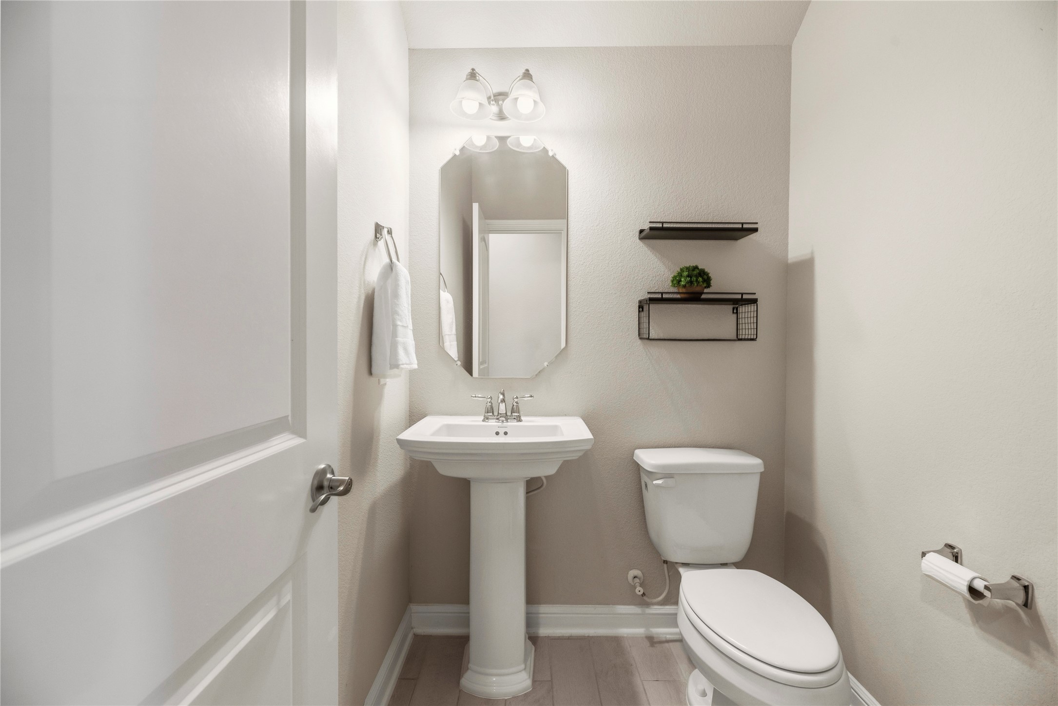 3319 Learning Tree Lane Rosenberg, TX 77471 - Photo 22 of 44 a bathroom with a toilet a sink and mirror