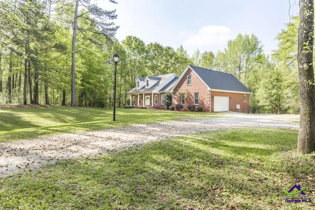 204 Smith Road Haddock, GA 31033 - Photo 2 of 51 a view of a house with a yard and tree s