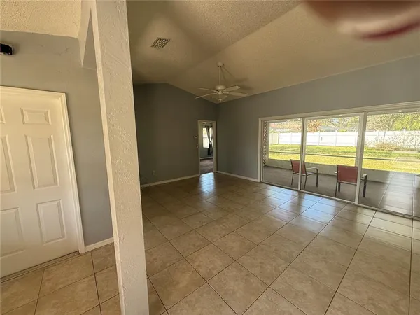 a view of an entryway and an empty room
