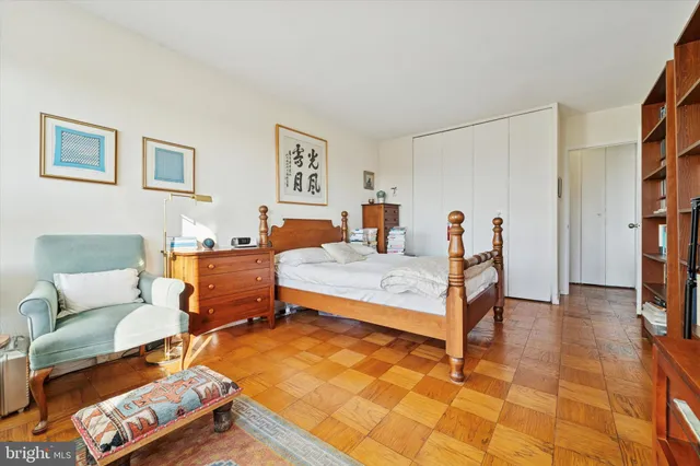 a bedroom with furniture and a rug