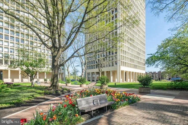 a front view of a building with a garden