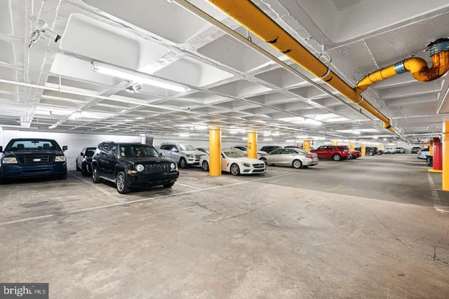 a view of parking space with parked cars