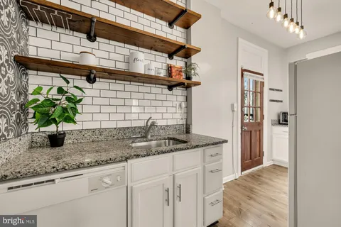a bathroom with sink and mirror
