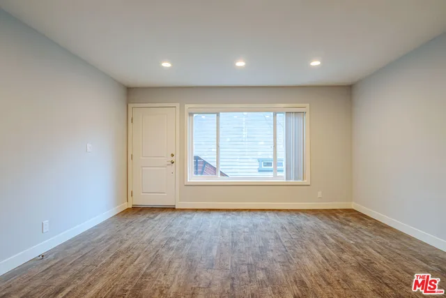 a kitchen with stainless steel appliances a refrigerator sink and microwave