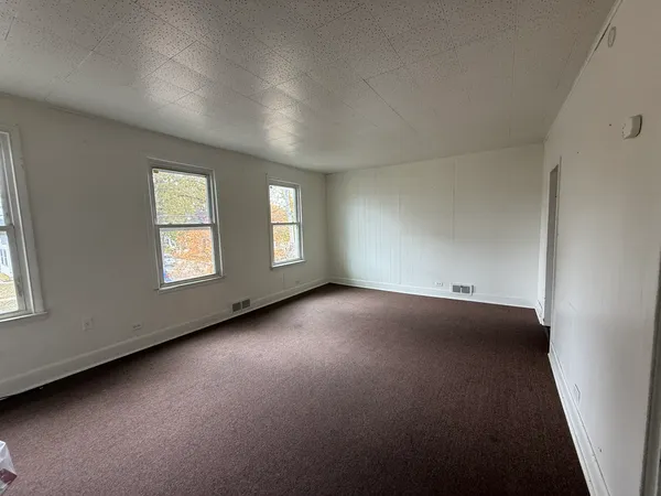 an empty room with windows