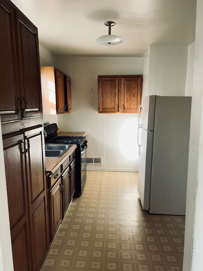 608 West Madison Street Ottawa, IL 61350 - Photo 13 of 23 a kitchen with stainless steel appliances granite countertop a refrigerator a stove and a refrigerator