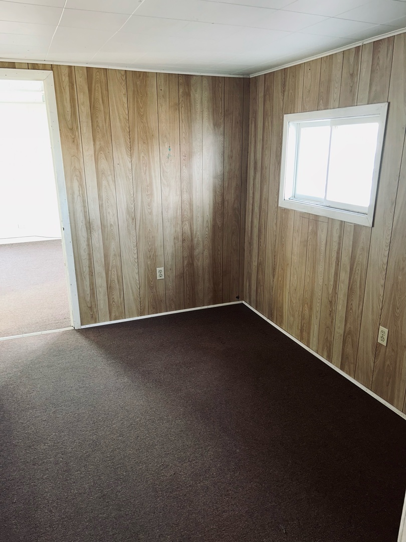 608 West Madison Street Ottawa, IL 61350 - Photo 16 of 23 a view of an empty room with wooden floor