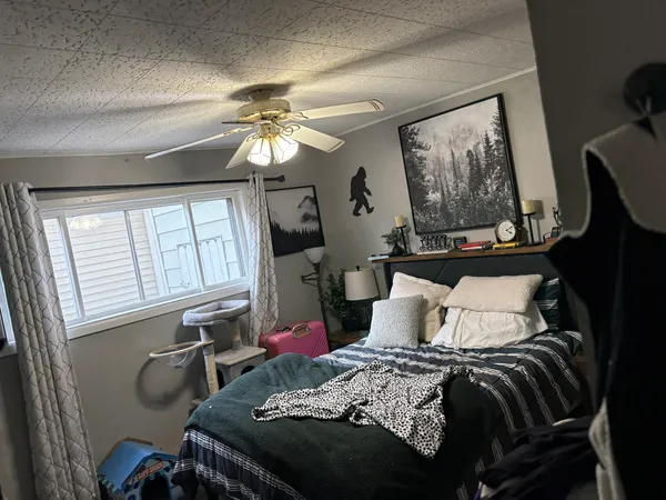 a bedroom with a bed and closet