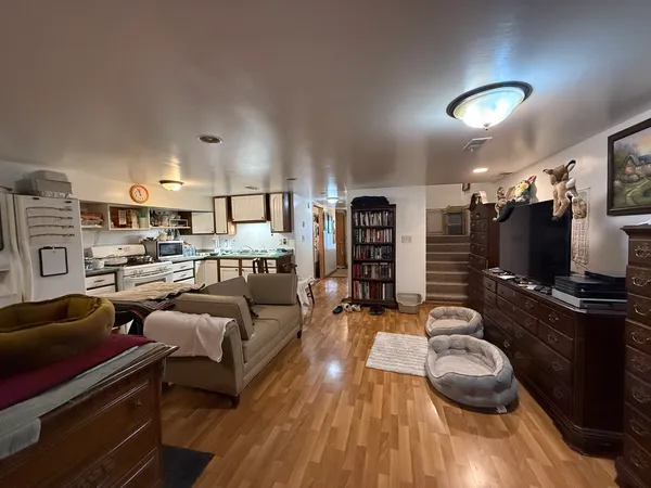 a bedroom with bed and a chandelier