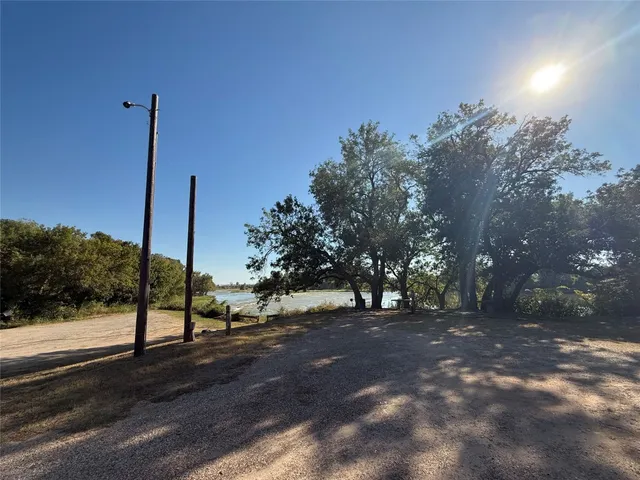 a view of a city with lush green forest