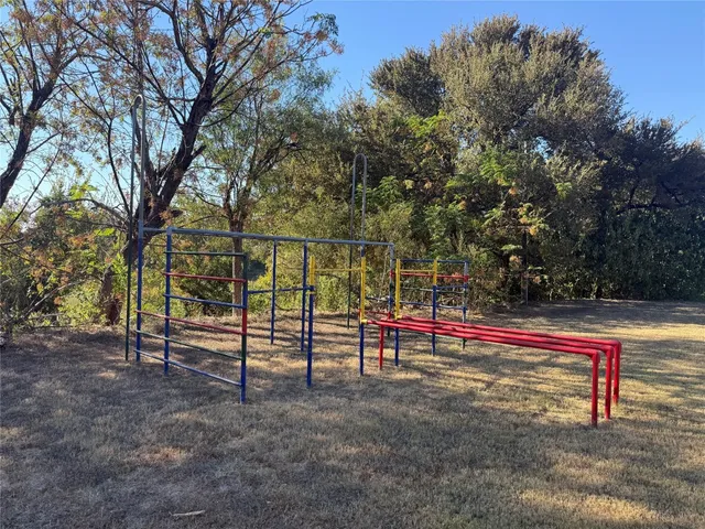 a view of a swimming pool with a yard