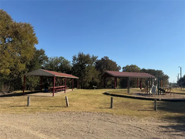 a swimming pool view with a seating space