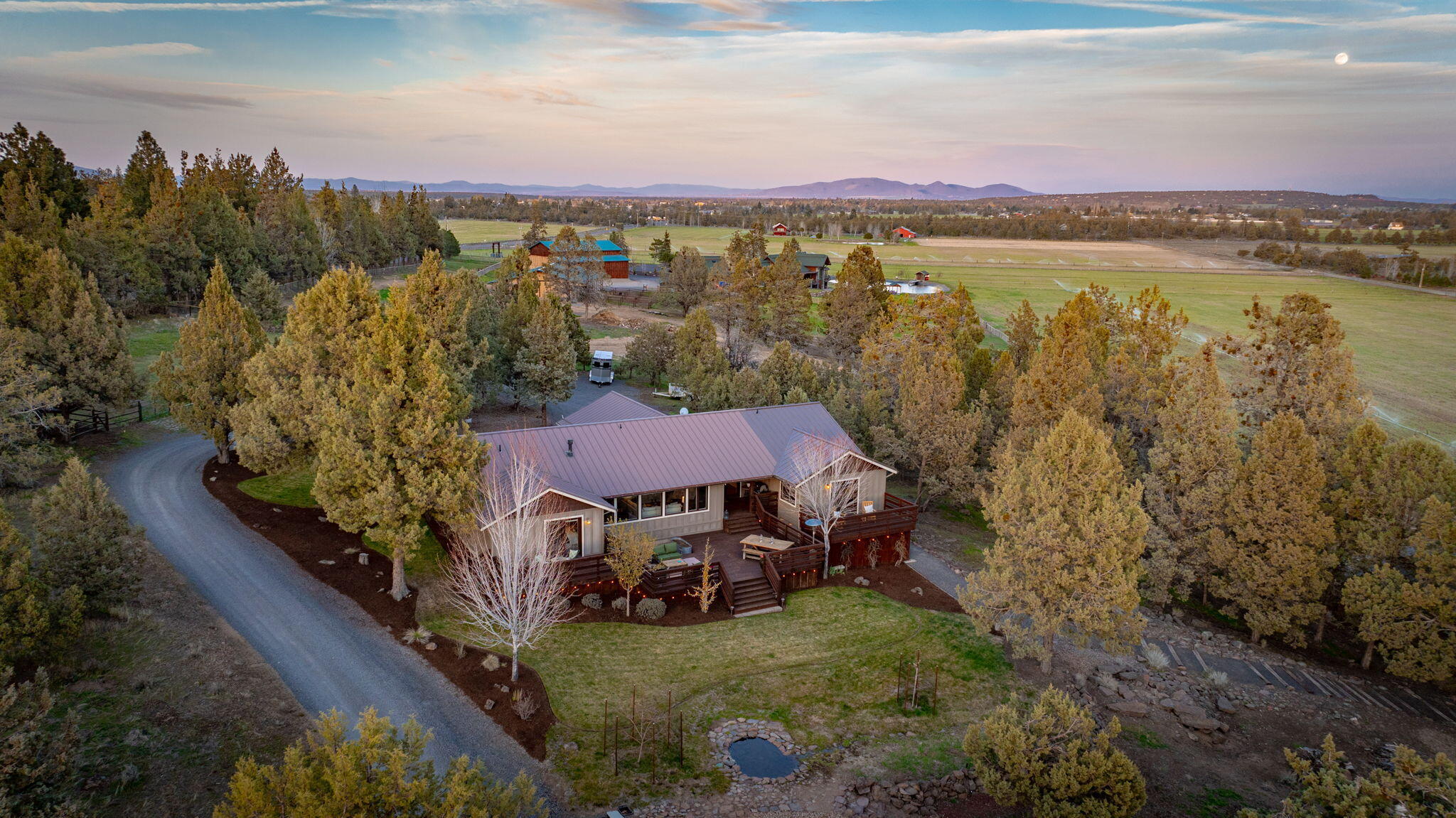 19395 Innes Market Road Bend, OR 97703 - Photo 6 of 75 a view of a house with a yard and lake view