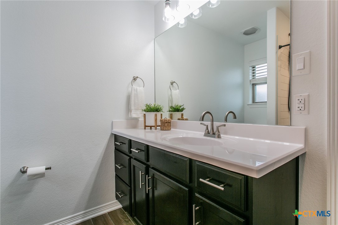 8304 Split Trl Cove Temple, TX 76502 - Photo 14 of 28 a bathroom with a sink and a mirror