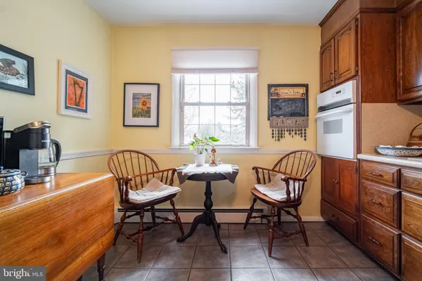 a dining room with furniture and window