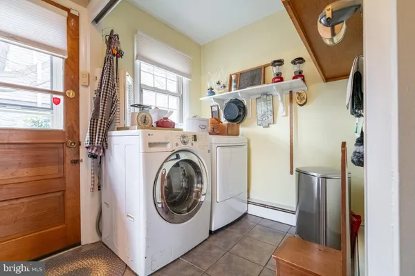 a utility room with dryer and washer