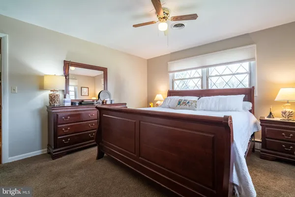 a bed room with a bed and a dresser