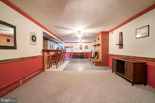 a view of a livingroom with furniture and a garage