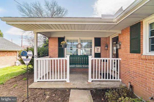 a view of porch with a bench