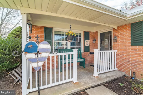 a front view of a house with a porch