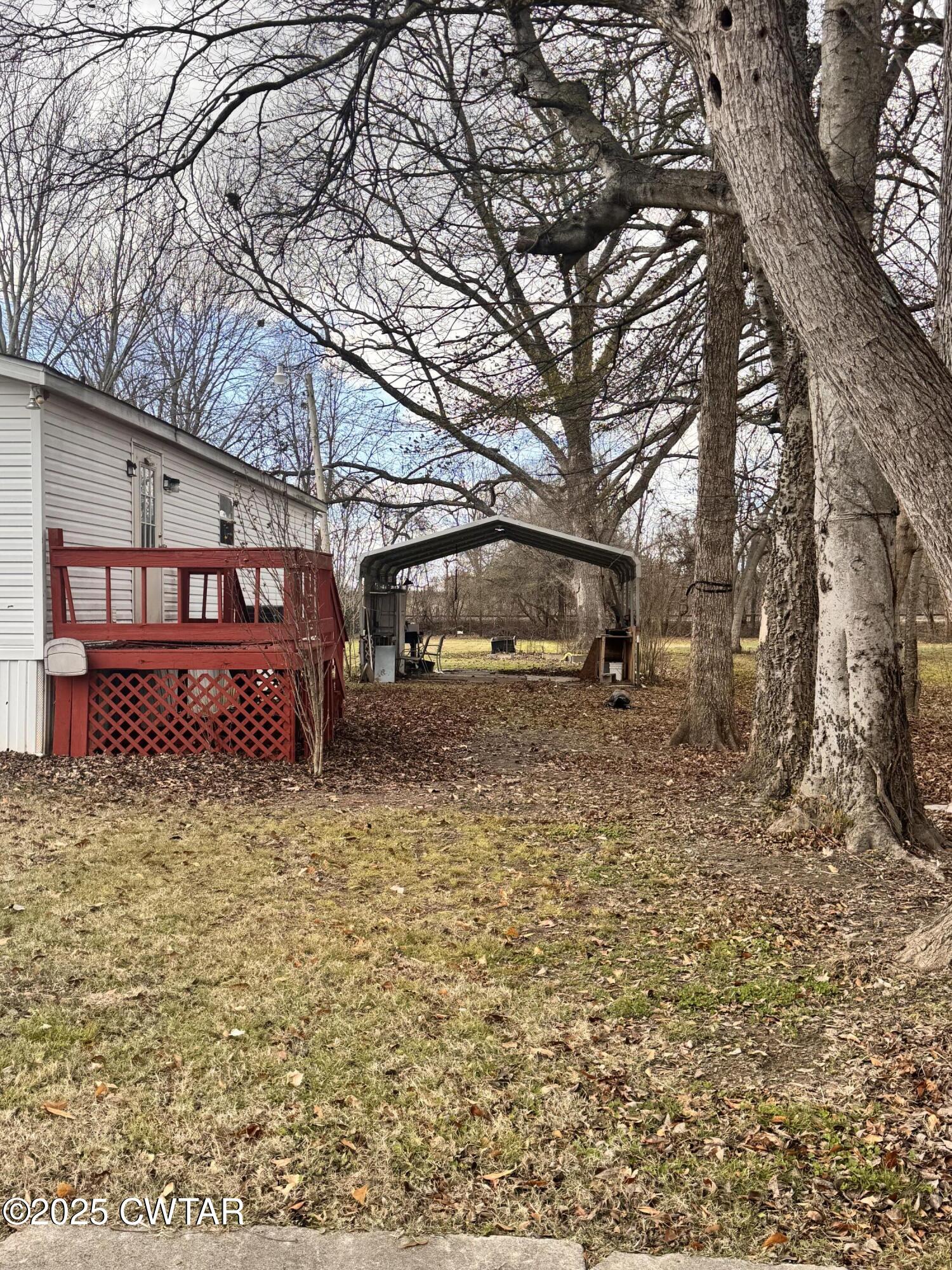 3416 West Troy Street Rives, TN 38253 - Photo 16 of 21 a view of a house with a yard