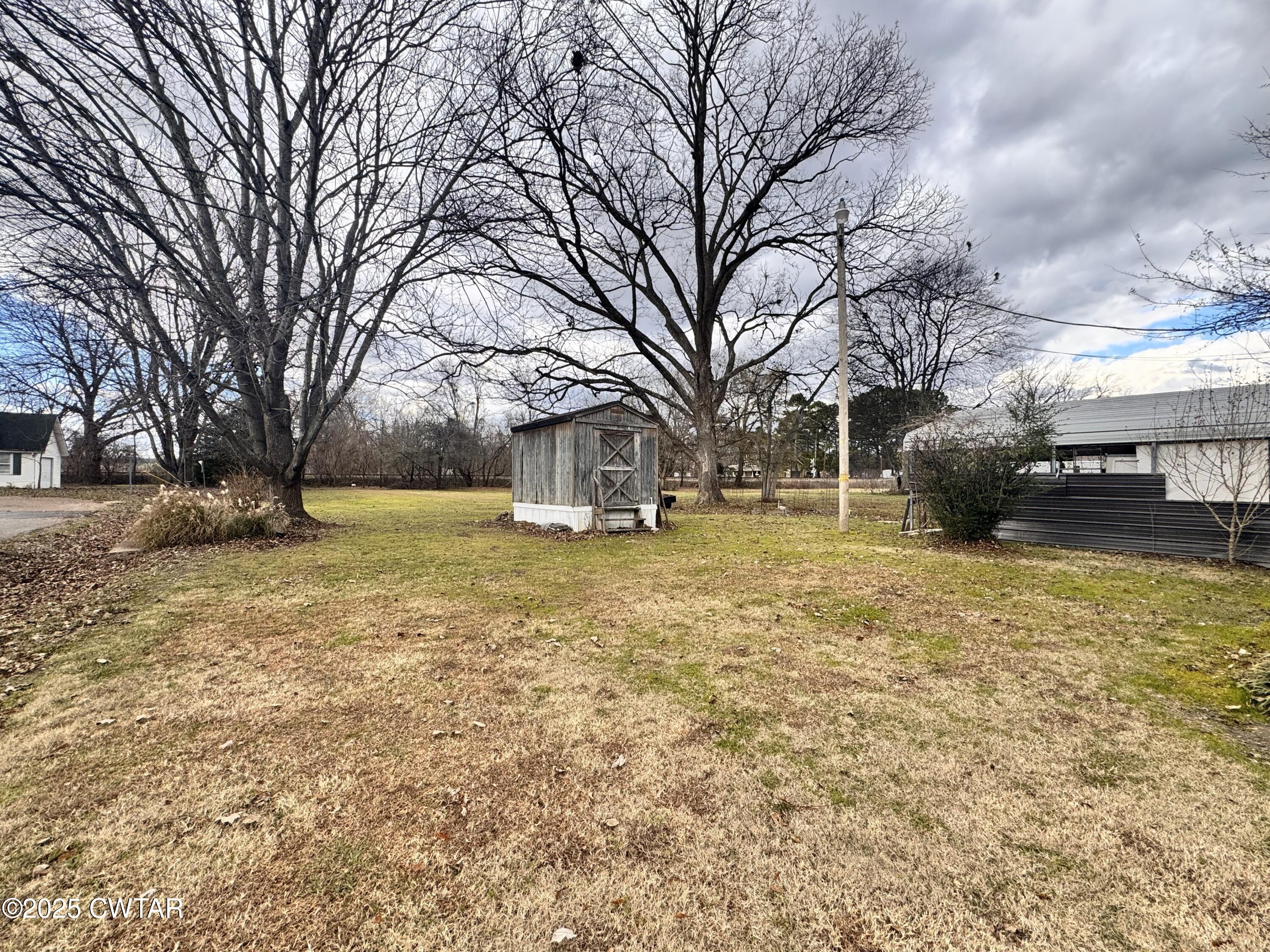 3416 West Troy Street Rives, TN 38253 - Photo 17 of 21 a view of a yard with a house