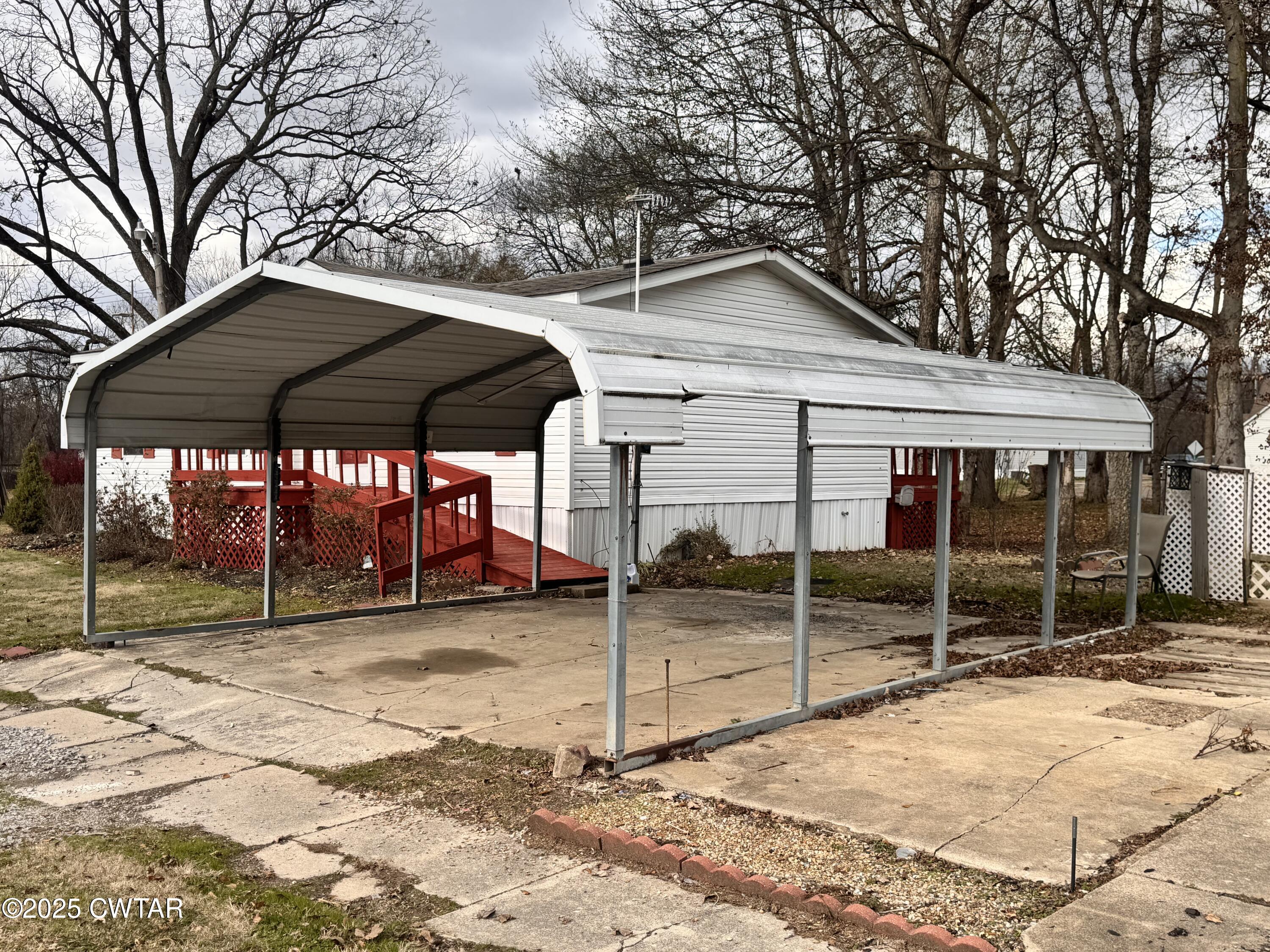 3416 West Troy Street Rives, TN 38253 - Photo 3 of 21 a view of wooden house with a yard and under an umbrella