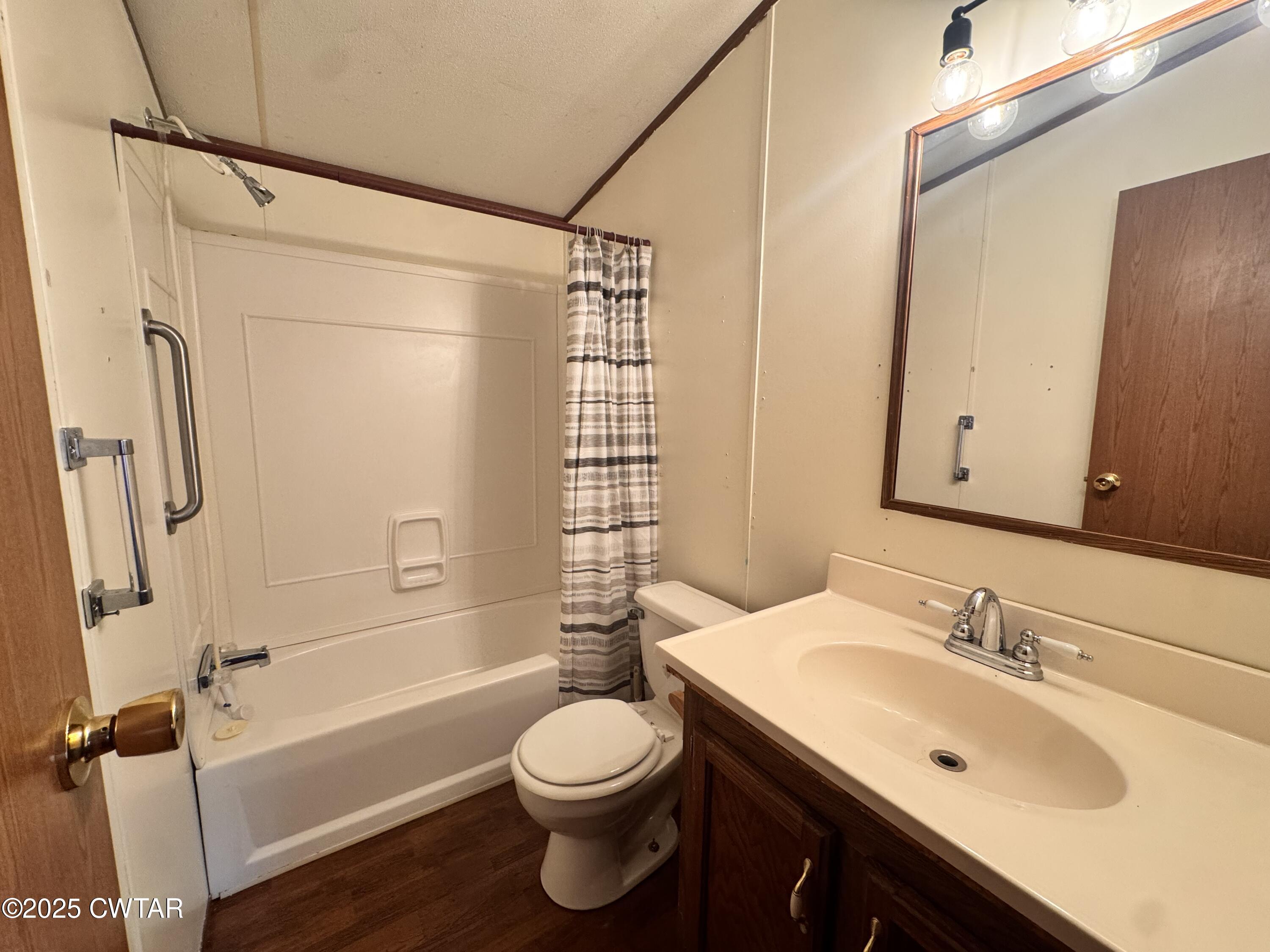 3416 West Troy Street Rives, TN 38253 - Photo 8 of 21 a bathroom with a sink a toilet and shower