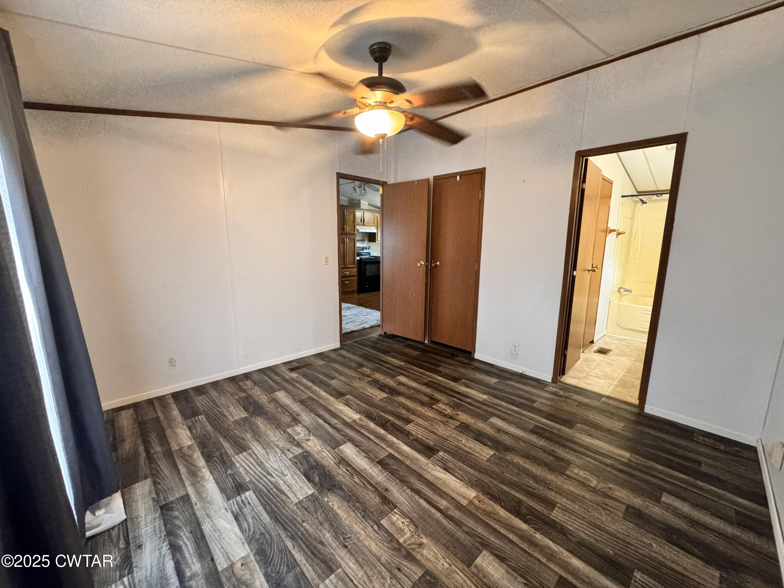3416 West Troy Street Rives, TN 38253 - Photo 10 of 21 a view of a room with wooden floor and fan