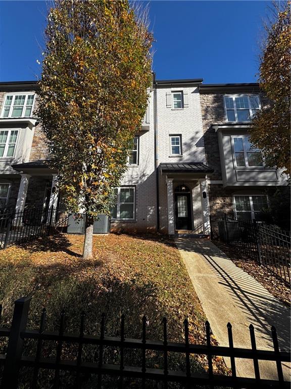 20 Wren Drive Roswell, GA 30076 - Photo 1 of 37 a front view of a house with a yard