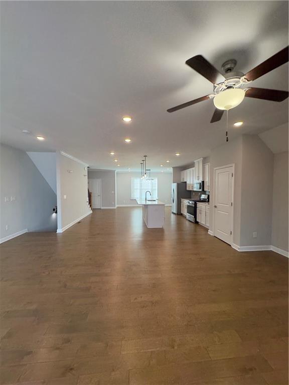 20 Wren Drive Roswell, GA 30076 - Photo 13 of 37 a view of empty room with wooden floor and ceiling fan