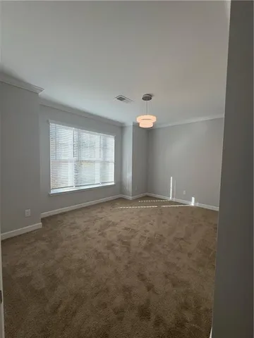 an empty room with a empty space and windows