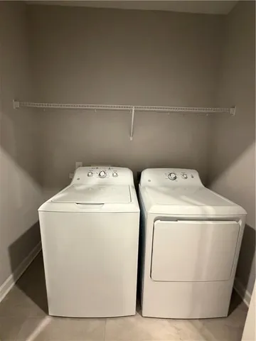 a stove top oven sitting inside of a kitchen