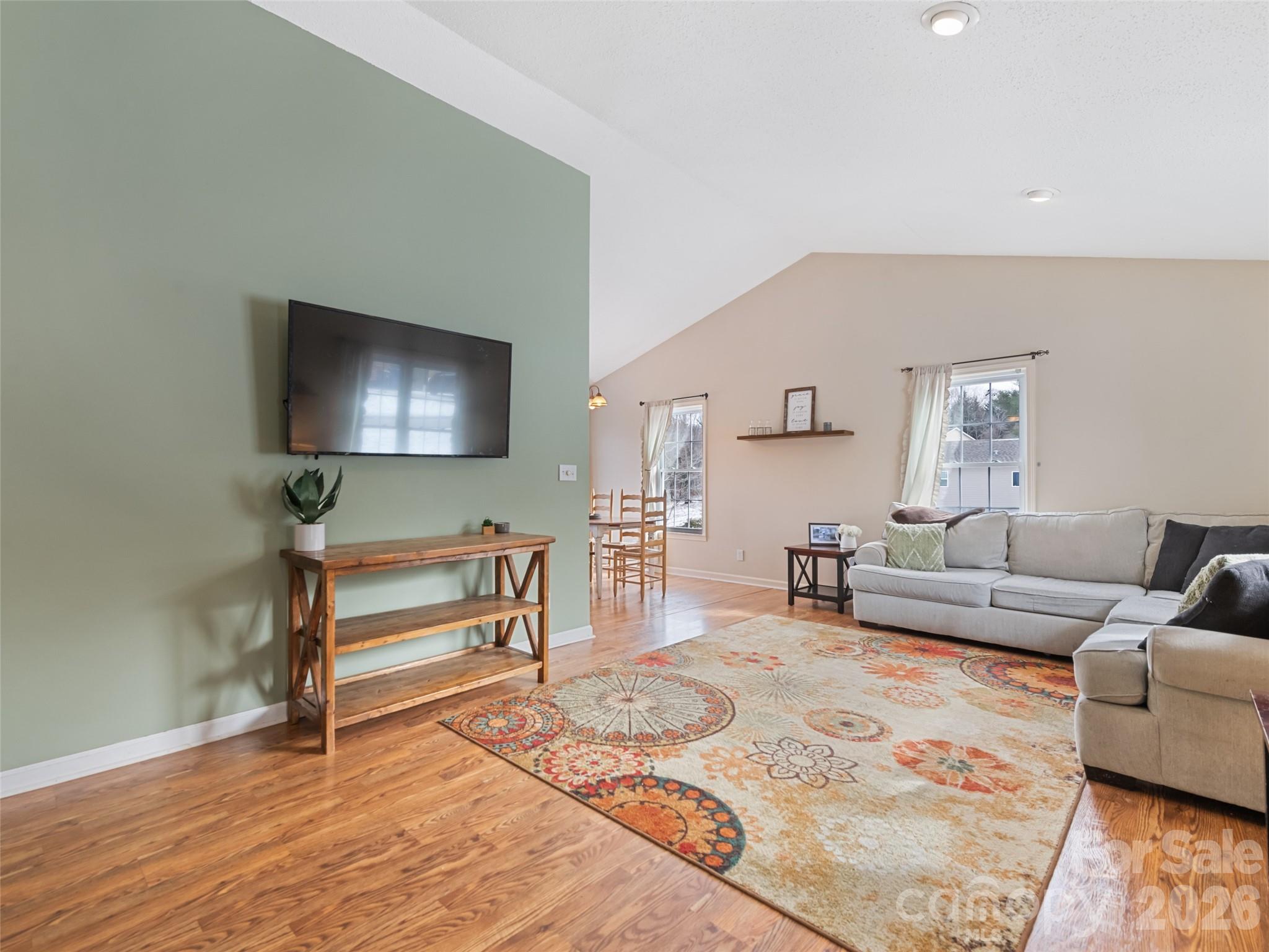 30 Woodruff Street Canton, NC 28716 - Photo 3 of 16 a living room with furniture and a flat screen tv