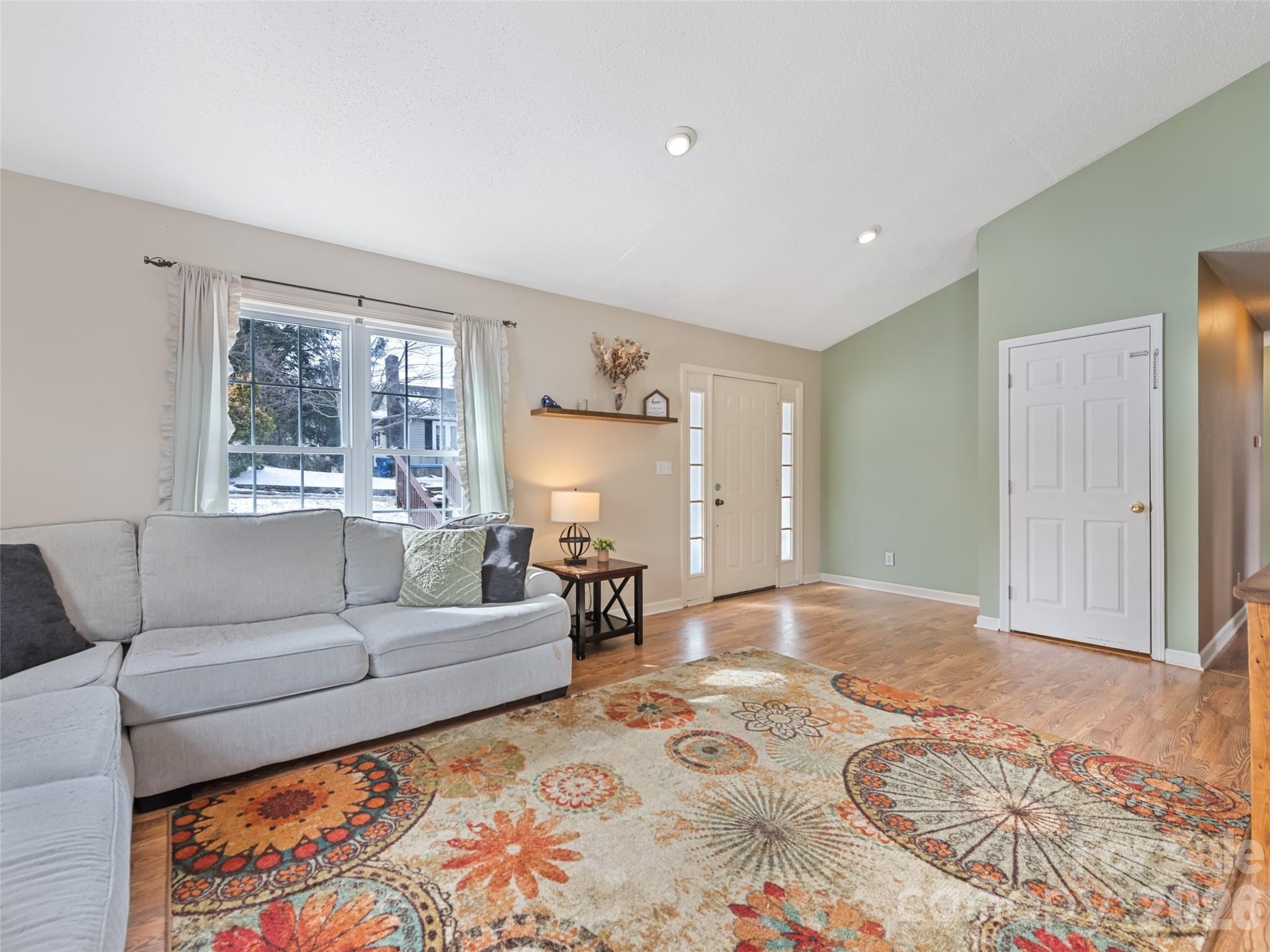 30 Woodruff Street Canton, NC 28716 - Photo 4 of 16 a living room with furniture and a rug