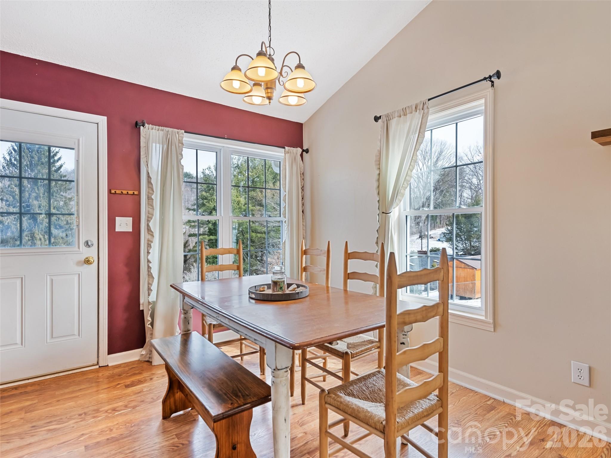 30 Woodruff Street Canton, NC 28716 - Photo 5 of 16 a dining room with furniture a chandelier and wooden floor