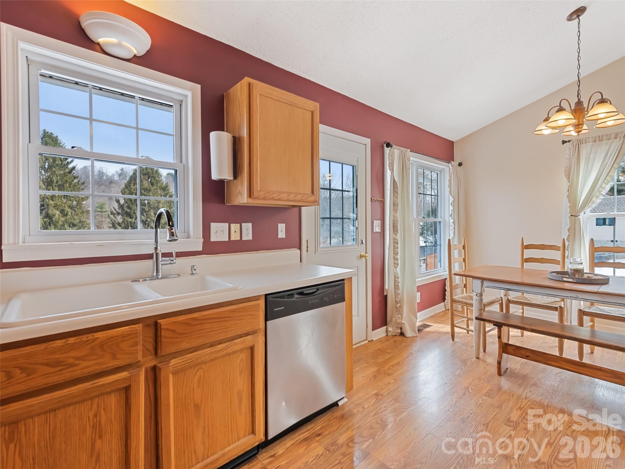 30 Woodruff Street Canton, NC 28716 - Photo 7 of 16 a kitchen with stainless steel appliances granite countertop a stove a sink and a refrigerator