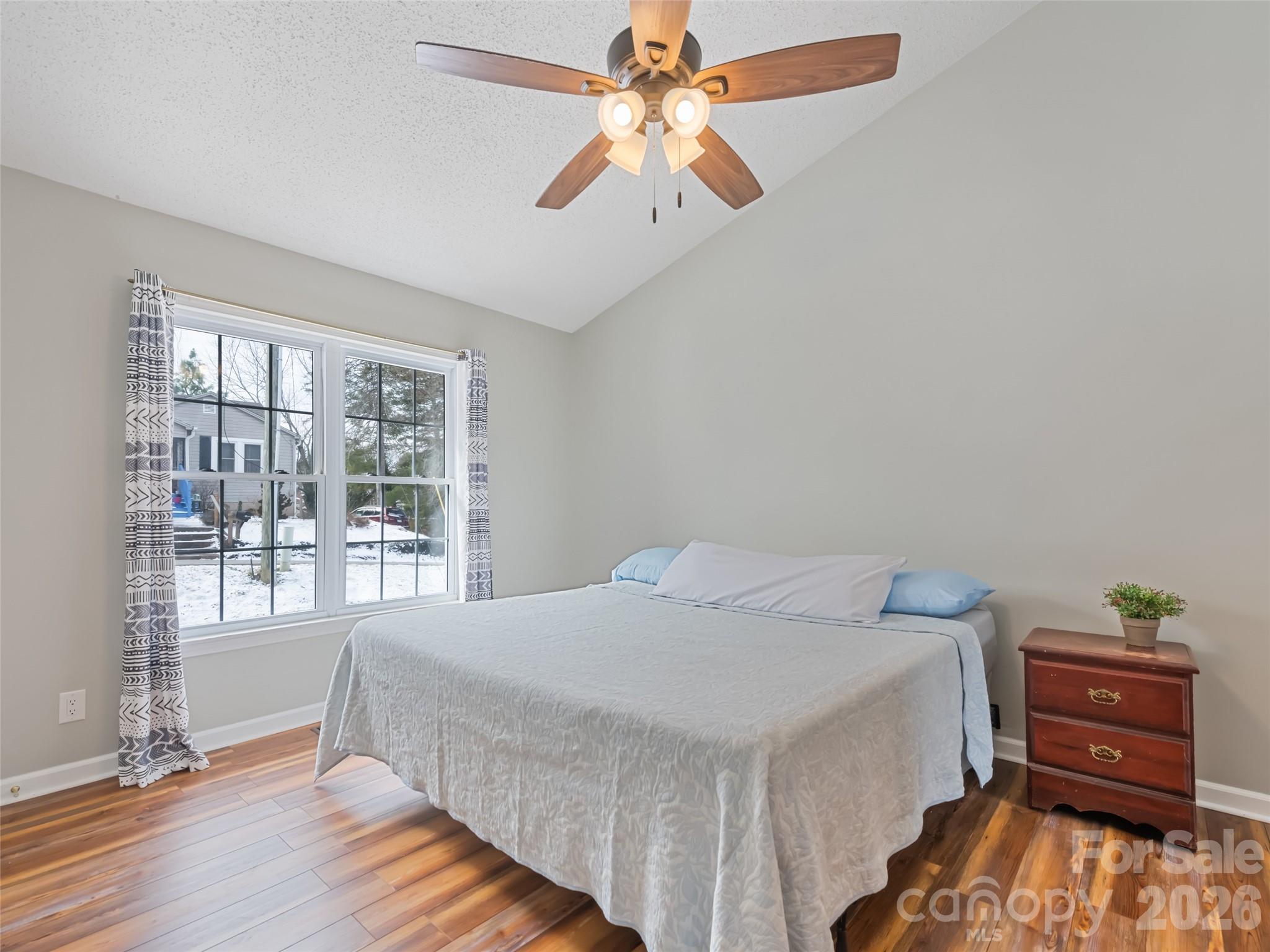 30 Woodruff Street Canton, NC 28716 - Photo 9 of 16 a bedroom with a bed and a window