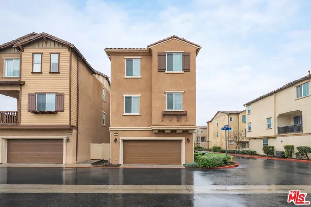 a front view of a house with garage