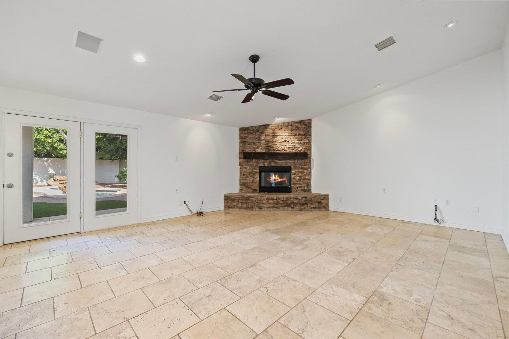 5233 North 15th Street Phoenix, AZ 85014 - Photo 14 of 55 a view of a livingroom with a fireplace and a chandelier