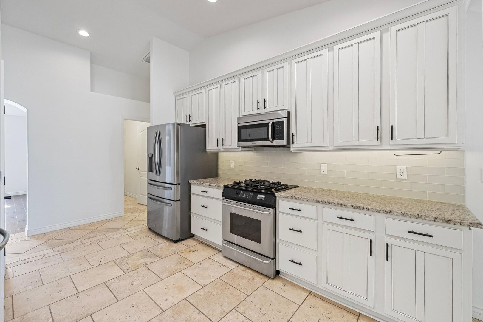 5233 North 15th Street Phoenix, AZ 85014 - Photo 23 of 55 a kitchen with a refrigerator stove and sink